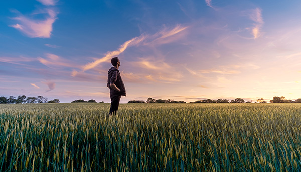 JPAc Call for comments cover: Man standing on a field