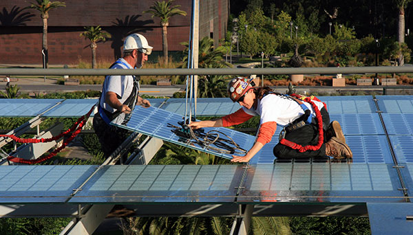 People installing solar pannels