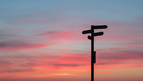 Public Consultation cover: Wooden sign post with the sunset on back