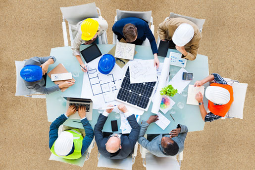 Team of engineers reviweing plans